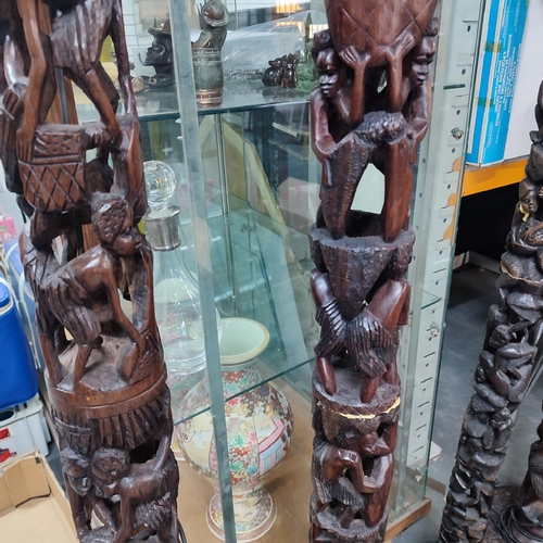 367 - Five heavily carved wooden African floor-lamps, a/f