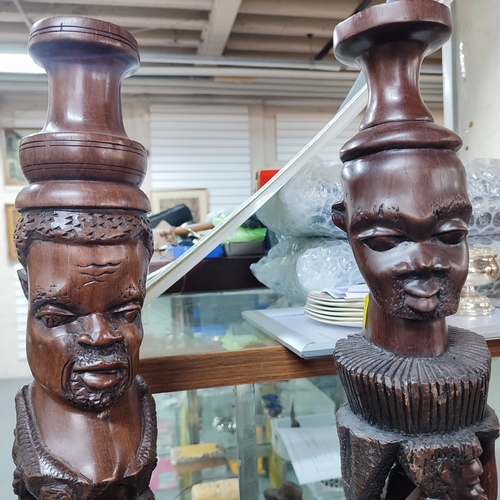 367 - Five heavily carved wooden African floor-lamps, a/f