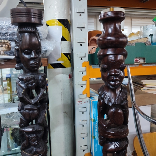 367 - Five heavily carved wooden African floor-lamps, a/f