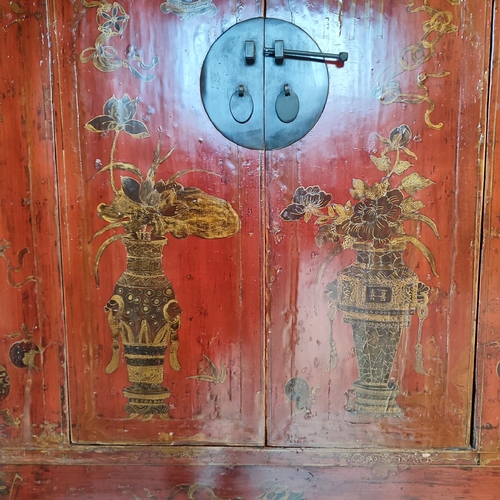 478 - MARRIAGE CABINET, A stunning red lacquered Chinese marriage cabinet, hand-painted depictions in gilt... 