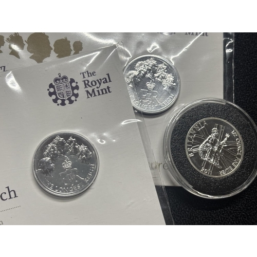 340 - Two £20 Royal Mint coins still in the packaging with Britannia 1/2 oz silver 2011 Britannia coin (3)