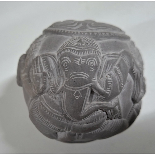 221 - Carved stone circular ball with animal and human form carvings