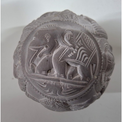 221 - Carved stone circular ball with animal and human form carvings