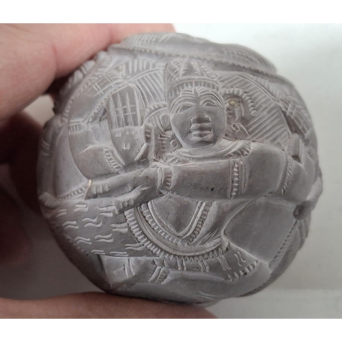 221 - Carved stone circular ball with animal and human form carvings