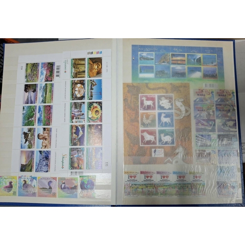 260A - Blue stock book containing a large quantity of modern mint unmounted Thailand and Malaysia stamp set... 