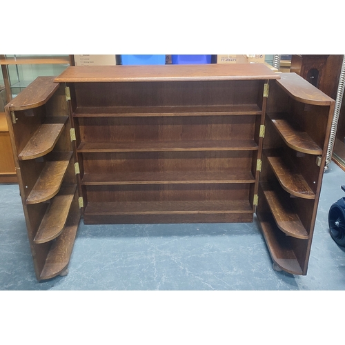 512 - Oak fold-out bookcase/drinks cabinet on castors