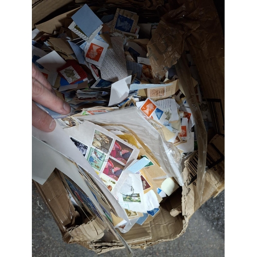 243 - Box crammed full of used stamps (Thousands)