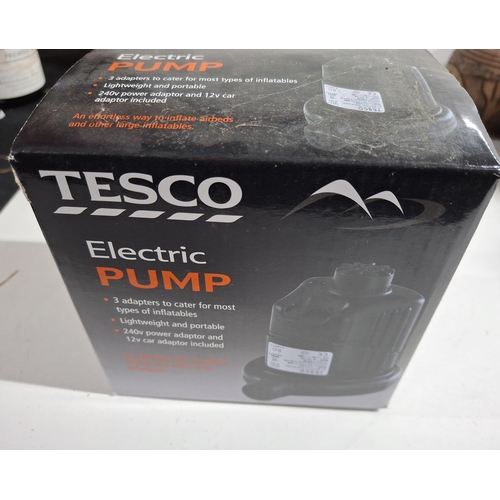 354 - Boxed, as new, an electric pump, by Tesco