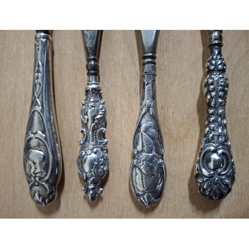 18 - Four antique silver handled shoe horns (4)