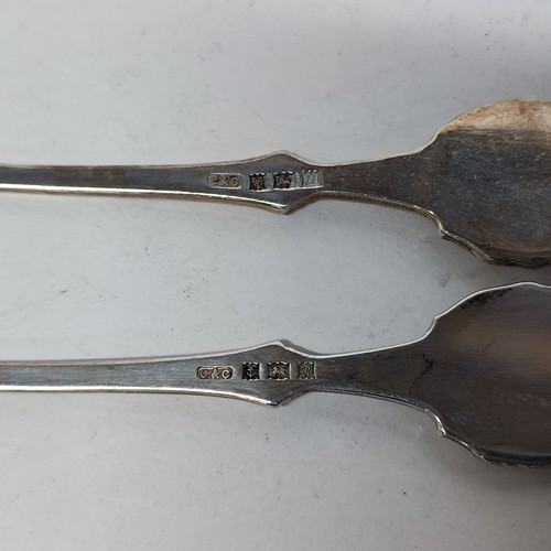 34 - 2 hallmarked Silver spoons, a pair of Silver Sugar nips and a Silver handled glove stretcher (4)

Si... 