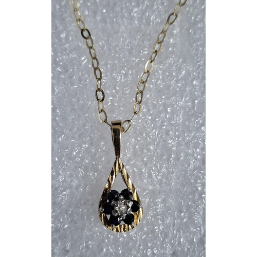 40 - Ladies fine gold chain stamped 9kt together with a hallmarked pendant containing a small central dia... 