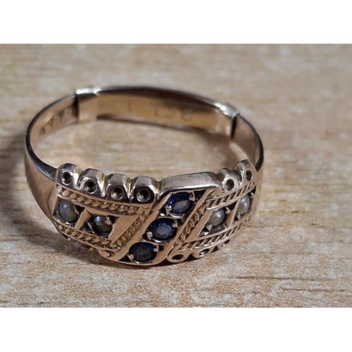 44 - Hallmarked 9ct Rose gold ring with 3 small round cut Sapphires with seed pearls to the outer flanks,... 