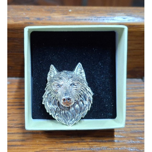 68 - STERLING SILVER WOLFS HEAD BROOCH