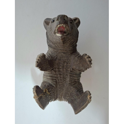 122 - Antique small, Black Forest carved wooden bear on its back,

Approx 10cm long