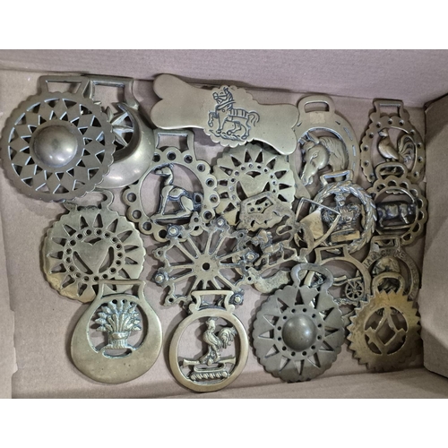 154 - Two boxes of various old horse brasses together with a few on leather martingales (Qty)