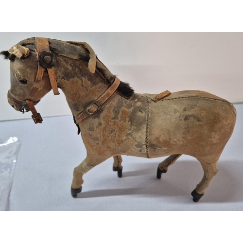 207 - Stunning antique stuffed, leather toy horse,

Approx 20cm long