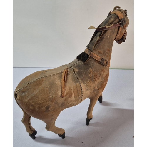 207 - Stunning antique stuffed, leather toy horse,

Approx 20cm long