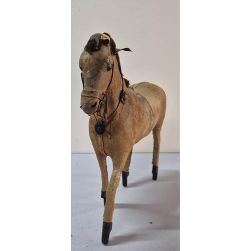 207 - Stunning antique stuffed, leather toy horse,

Approx 20cm long