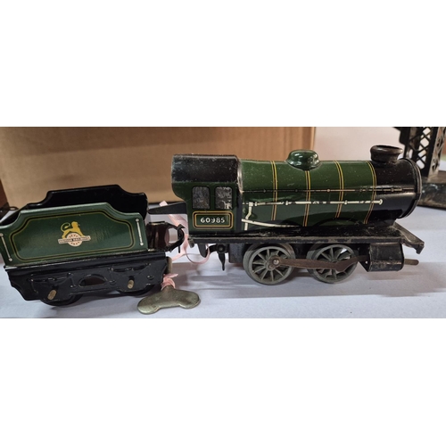 208 - Early, wind-up tin plate steam train with trucks, train track and signals set (Qty)