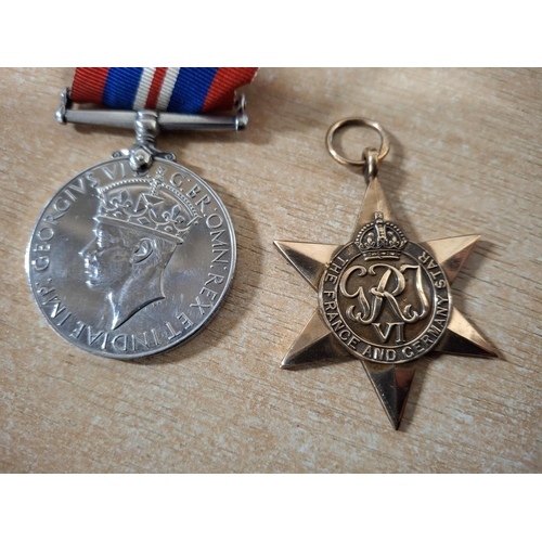 213 - British 1939-45 War Medal together with a France and Germany star medal (2)