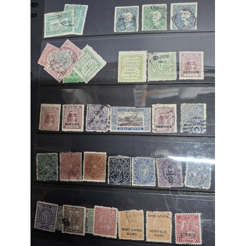 269 - Four full pages of Queen Victoria and antique India government and Indian states postage due stamps,... 