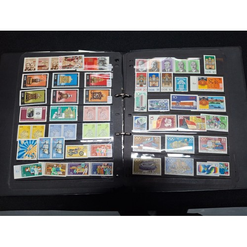 296 - Black album containing a large quantity of DDR east German stamps from 1968 - 1980 (Qty)