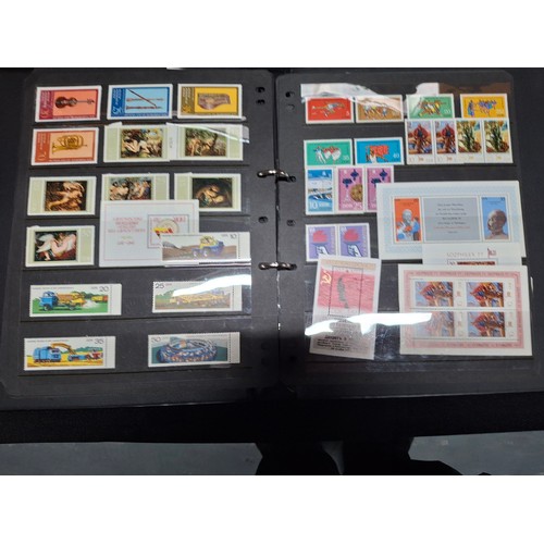 296 - Black album containing a large quantity of DDR east German stamps from 1968 - 1980 (Qty)