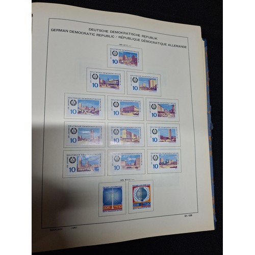 297 - Blue album containing a large quantity of mounted DDR east German stamps (Qty)