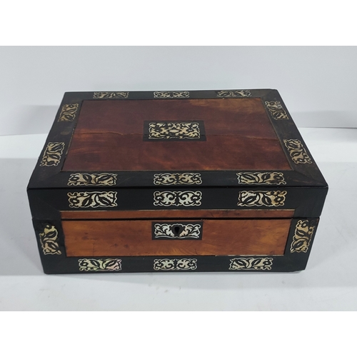 385 - An ornate Victorian inlaid sewing box with contents, some possibly Silver