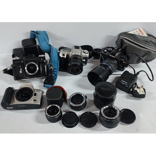 394 - Selection of camera equipment including Olympus, Minolta and various lenses etc. (Qty)