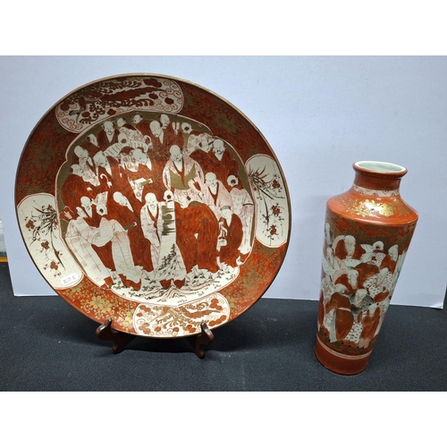 407 - Large Japanese Satsuma plate, festooned with figures together with a similar matching vase, both mar... 