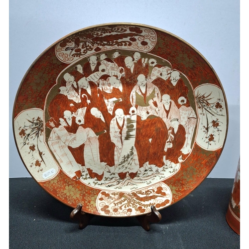 407 - Large Japanese Satsuma plate, festooned with figures together with a similar matching vase, both mar... 