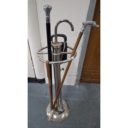 399 - Art Deco style, white metal stick stand complete with a couple of fancy walking sticks, a shooters s... 