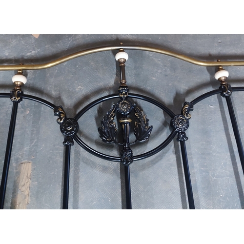 430 - An ornate reproduction iron bed with H/B, F/B, rails, slats and fittings