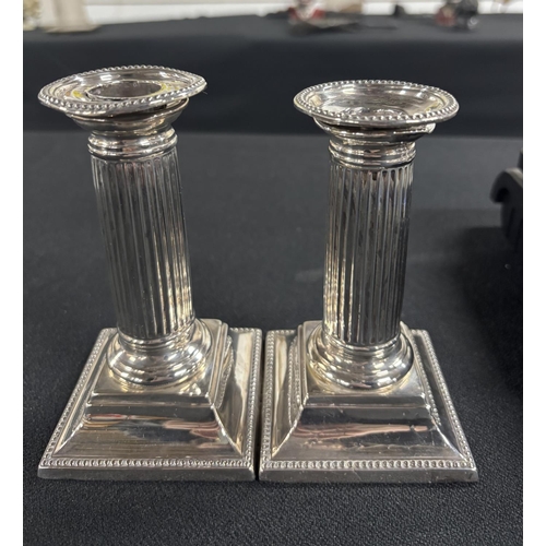 28 - Pair of hallmarked silver candle sticks in classical columned form with weighted bases (2)

670 gram... 