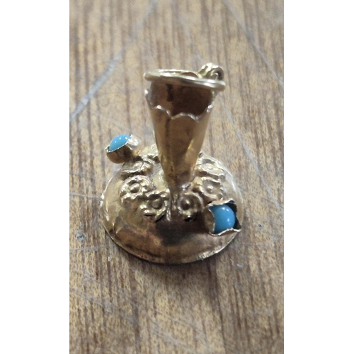 44 - 9ct gold bracelet charm in the shape of an old jug