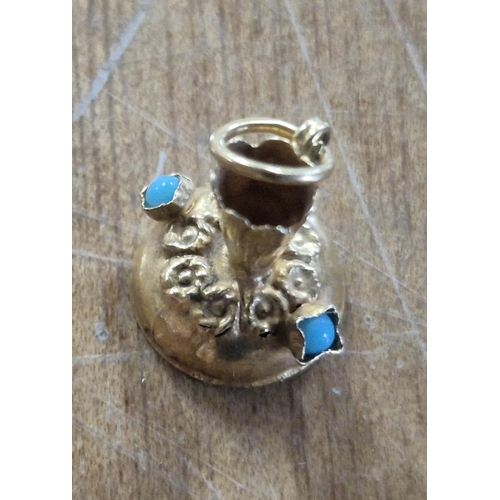 44 - 9ct gold bracelet charm in the shape of an old jug