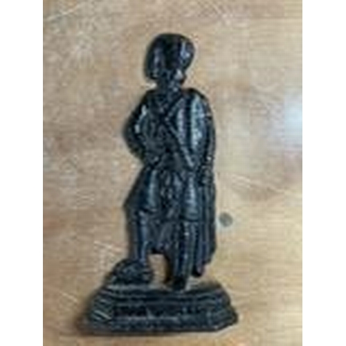 76 - Old cast iron door stop, painted black, in the form of a man wearing a cape