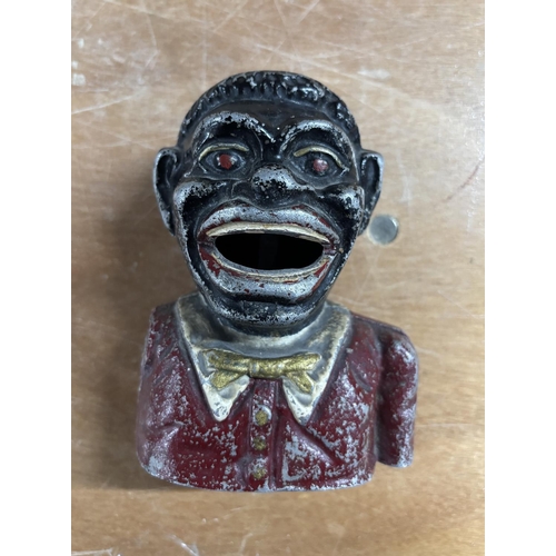 78 - Very old, cast iron money box figurine