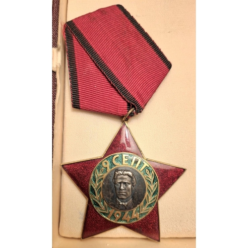 89 - Two boxed Bulgaria medals, order of 9 September 1944, red enamels together with peoples republic of ... 