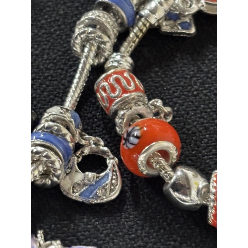 39 - 3 Pandora style bracelets with some 925 charms