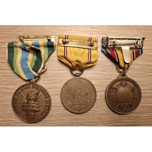 106 - Three USA WWII era medals to include the defense medal, the New York National Guard recruiting medal... 