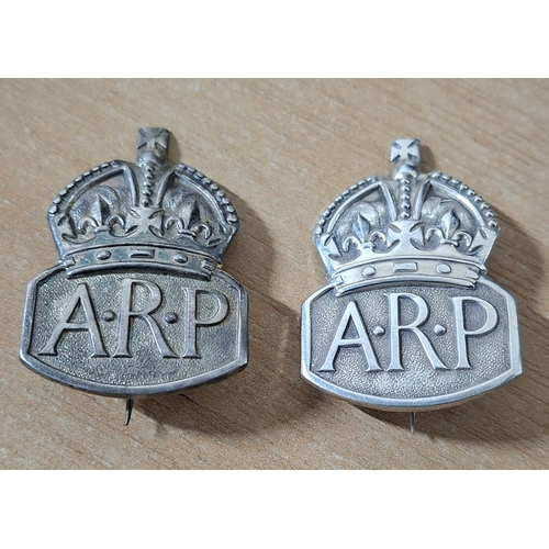 114 - Two 1938 original hallmarked silver A.R.P badges produced by the Royal Mint, marked J.C for Sir John... 