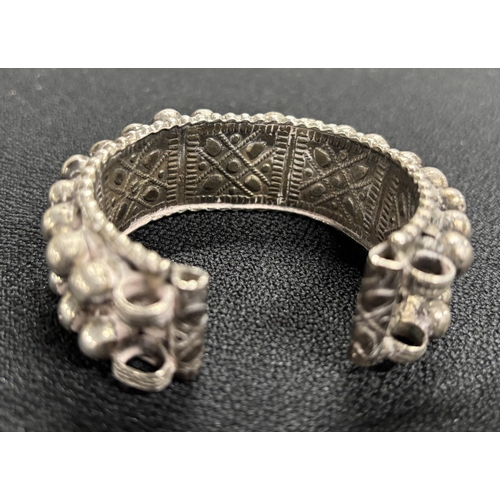 128 - Old African studded white metal bracelet,

approx 132 grams