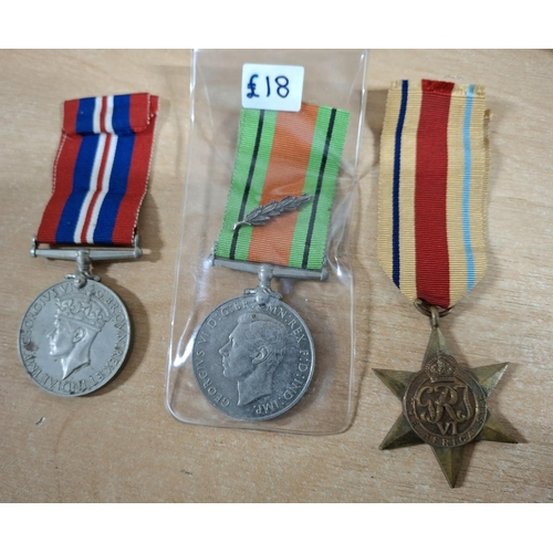 131 - Set of three WWII British medal set - the war medal, the defence medal and the Africa star (3)