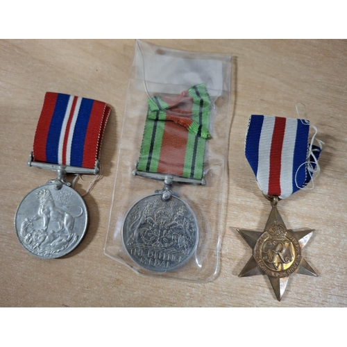 132 - Set of three WWII British medal set - the war medal, the defence medal and the France and Germany st... 