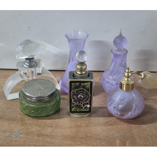 135 - Six ladies toilet items to include 4 perfume bottles including an Art Deco example, a powder jar and... 