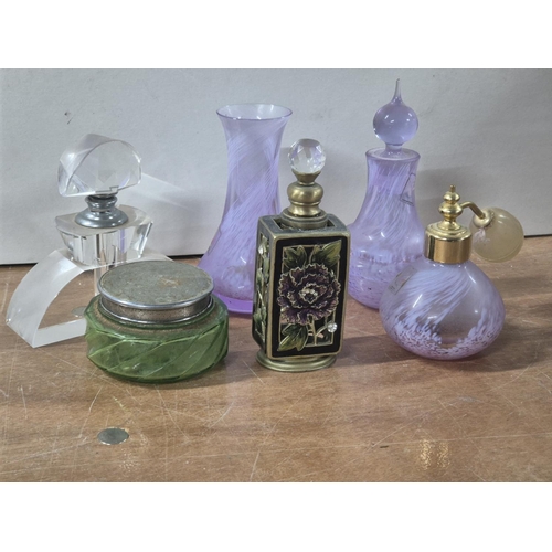 135 - Six ladies toilet items to include 4 perfume bottles including an Art Deco example, a powder jar and... 