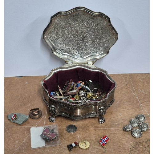 141 - White metal trinket box containing a large quantity of metal buttons and modern enamel badges