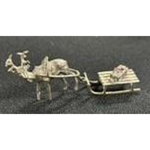 144 - Well cast, tiny white metal Reindeer with Sledge,

approx 10cm long